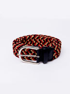 Flat lay of hand woven belt, braided and handmade in Italy with the Newmarket signature colours (gold, tan, navy) and a stretch design.