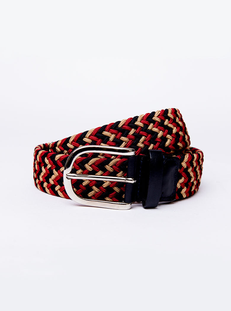 Flat lay of hand woven belt, braided and handmade in Italy with the Newmarket signature colours (gold, tan, navy) and a stretch design.