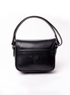 Flat lay of a small premium bridle butt navy leather crossbody Faith hand bag that has been hand stitched in England with 1 front facing buckle strap and the back embossed with Newmarket 875 horse logo.