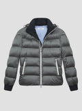 Grey puffer jacket with black suede lining on the inside collar with black elasticated cuffs. Contrast pale grey zips and baby blue jacket lining. Detachable hood. 