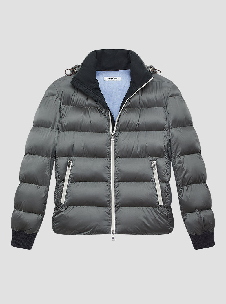 Grey puffer jacket with black suede lining on the inside collar with black elasticated cuffs. Contrast pale grey zips and baby blue jacket lining. Detachable hood. 