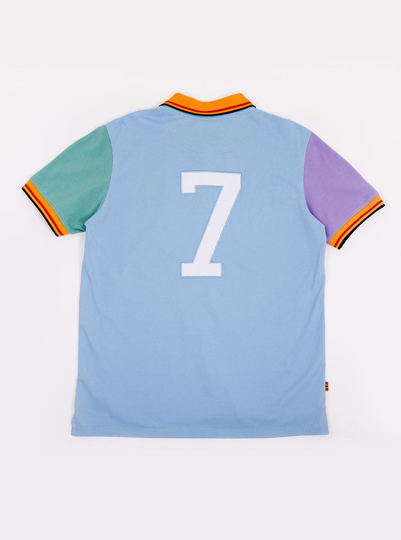 Flat lay of men's multicoloured polo shirt with newmarket 875 crest on the front and number 7 on the back, made of 100% cotton.