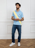 Man wearing sky blue 100% cotton polo shirt with lemon yellow sash detail and Newmarket 875 horse logo embroidered on the front.