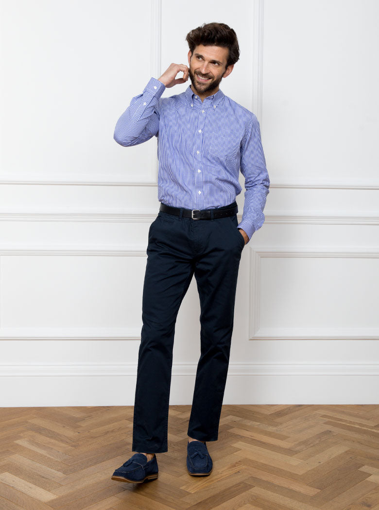 Man wearing royal blue gingham shirt made from 100% cotton poplin.