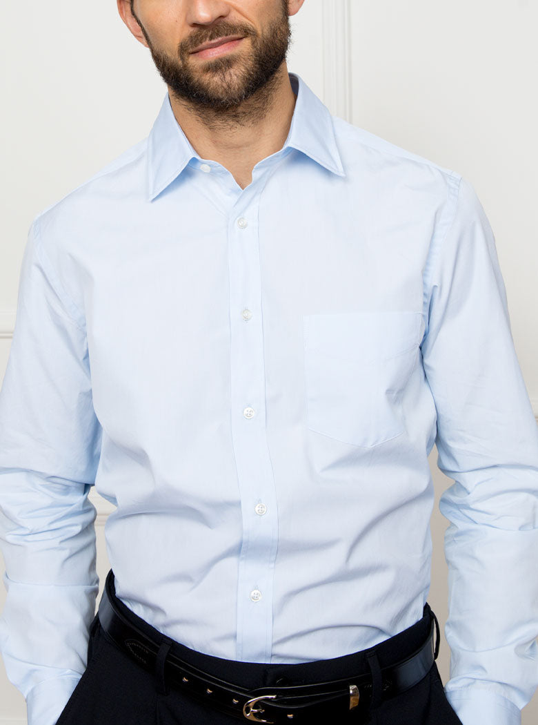 Man wearing sky blue long sleeved shirt made with 100% Royal Oxford Cotton.