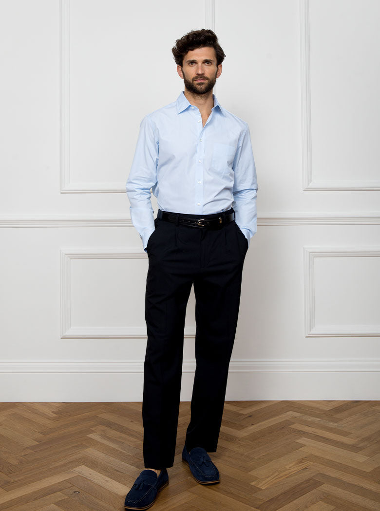 Man wearing sky blue long sleeved shirt made with 100% Royal Oxford Cotton.