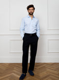 Man wearing sky blue long sleeved shirt made with 100% Royal Oxford Cotton.