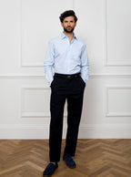 Man wearing sky blue long sleeved shirt made with 100% Royal Oxford Cotton.