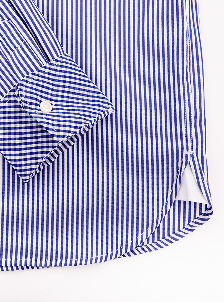 Flat lay of men's long sleeved shirt with navy blue thin stripe and gingham cuff and collar pattern on the inside. Made with 100% cotton in Thomas Mason fabric.
