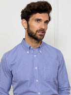 Man wearing royal blue gingham shirt made from 100% cotton poplin.
