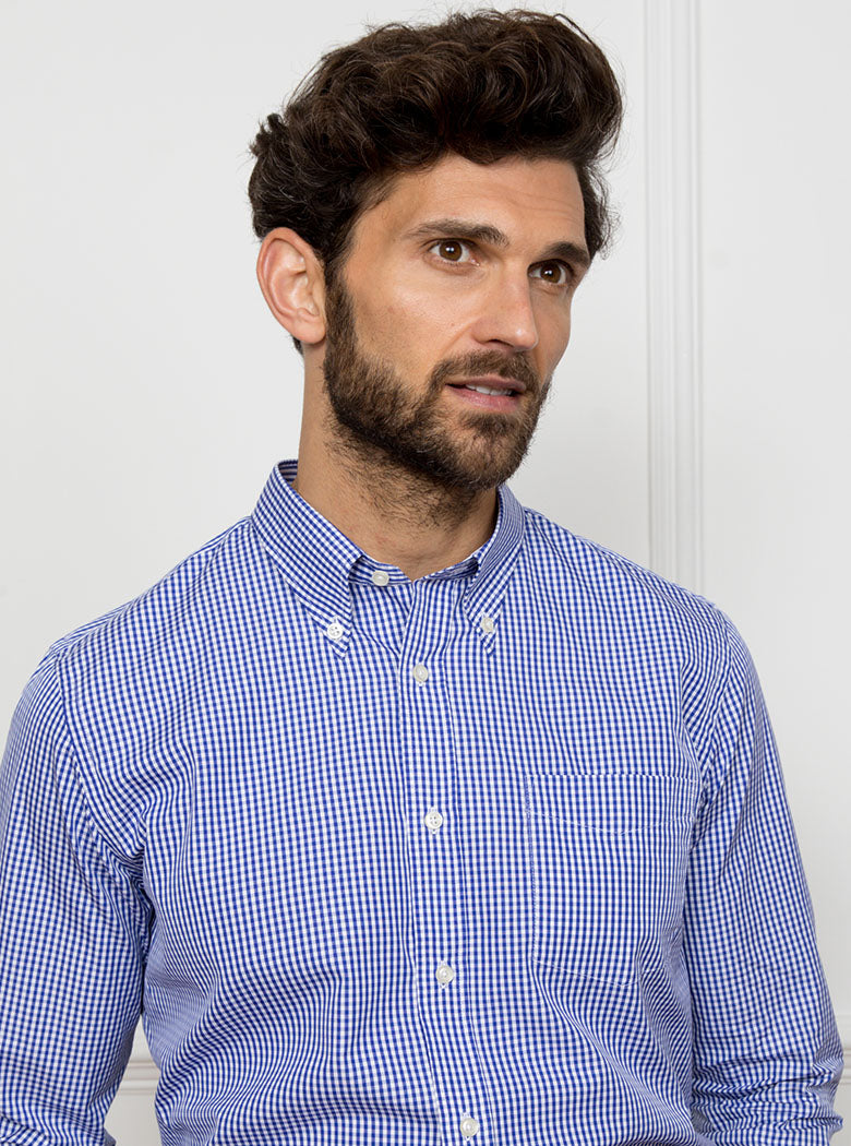Man wearing royal blue gingham shirt made from 100% cotton poplin.