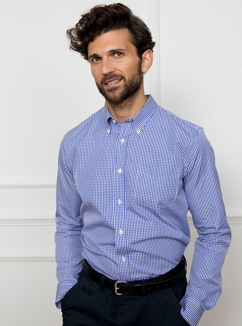 Man wearing royal blue gingham shirt made from 100% cotton poplin.