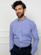 Man wearing royal blue gingham shirt made from 100% cotton poplin.