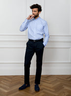 Man wearing sky blue long sleeved shirt in a gingham pattern made with 100% cotton in a Thomas Mason fabric.