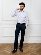 Man wearing long sleeved shirt in a tattersall blue check pattern design with premium and luxury cotton in Thomas Mason fabric.