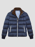 Navy gloss puffer jacket with brown suede lining on the inside collar with navy elasticated cuffs. Contrast pale grey zips and baby blue jacket lining. Detachable hood.